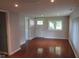 Bright living room featuring hardwood floors and an open floor plan at 3912 Terrace Ave, Indianapolis, IN 46203