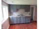 Updated kitchen with gray cabinets and a marble countertop at 3912 Terrace Ave, Indianapolis, IN 46203