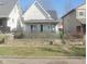 White house with front porch and chain link fence at 860 Udell St, Indianapolis, IN 46208