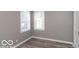Simple bedroom with hardwood floors and neutral walls at 3755 N Hawthorne Ln, Indianapolis, IN 46218