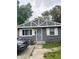 Gray house with white trim and a security door at 533 Lynn St, Indianapolis, IN 46222