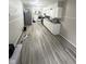 Eat-in kitchen features white cabinets and vinyl flooring at 533 Lynn St, Indianapolis, IN 46222