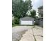 Detached single-car garage with a large driveway at 533 Lynn St, Indianapolis, IN 46222