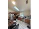 Kitchen boasts wood cabinets, granite counters, and a skylight at 1062 N Berwick Ave, Indianapolis, IN 46222
