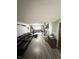 Spacious living room with hardwood floors and sectional sofa at 1062 N Berwick Ave, Indianapolis, IN 46222