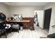 Small kitchen with wood cabinets and laminate floor at 1062 N Berwick Ave, Indianapolis, IN 46222