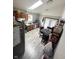 Kitchen with wood cabinets, granite countertop, and stainless steel appliances at 1062 N Berwick Ave, Indianapolis, IN 46222