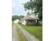 House exterior with driveway, garage and front yard at 1062 N Berwick Ave, Indianapolis, IN 46222