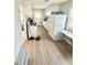 Kitchen with white cabinets, appliances, and light flooring at 3521 N Riley Ave, Indianapolis, IN 46218