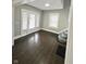 Bright living room with hardwood floors and large windows at 20 N Pershing Ave, Indianapolis, IN 46222