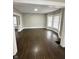 Spacious living room featuring hardwood floors and bay windows at 20 N Pershing Ave, Indianapolis, IN 46222