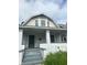 Two-story house with white brick and a covered porch at 20 N Pershing Ave, Indianapolis, IN 46222