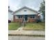 Charming craftsman home with brick details and porch at 57 N Tremont St, Indianapolis, IN 46222