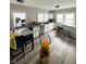 Eat-in kitchen with white cabinets and hardwood floors at 57 N Tremont St, Indianapolis, IN 46222