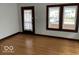 Living room with hardwood floors and large windows at 57 N Tremont St, Indianapolis, IN 46222