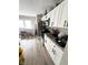 Spacious kitchen with granite countertops and white cabinets at 57 N Tremont St, Indianapolis, IN 46222
