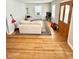Living room with hardwood floors and beige sofa at 1618 N Linwood Ave, Indianapolis, IN 46218