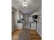 Kitchen with white cabinets, wood floors, and appliances at 1618 N Linwood Ave, Indianapolis, IN 46218