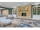 Finished basement with stone fireplace and built-in shelving at 4023 Cedar Hills N Dr, Greenwood, IN 46143