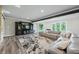 Finished basement recreation room with comfortable seating and large screen TV at 4023 Cedar Hills N Dr, Greenwood, IN 46143