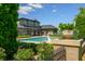 Stunning view of a luxurious home with a beautiful pool and meticulously landscaped grounds at 4023 Cedar Hills N Dr, Greenwood, IN 46143