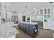Large kitchen island with granite countertops and dark gray cabinets at 4023 Cedar Hills N Dr, Greenwood, IN 46143