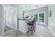 Kitchen breakfast bar with granite countertop and two black leather barstools at 4023 Cedar Hills N Dr, Greenwood, IN 46143