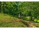 Landscaped pond with fountain, nestled in trees at 4023 Cedar Hills N Dr, Greenwood, IN 46143