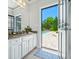Bathroom with pool view, granite countertop, and white cabinets at 4023 Cedar Hills N Dr, Greenwood, IN 46143