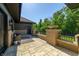 Brick patio with seating area and tranquil garden view at 4023 Cedar Hills N Dr, Greenwood, IN 46143