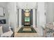 Bright hallway showcasing a water feature and marble flooring at 4023 Cedar Hills N Dr, Greenwood, IN 46143