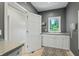 Bright laundry room with white cabinets and a window at 4023 Cedar Hills N Dr, Greenwood, IN 46143