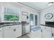 Kitchen with white cabinets, granite countertops, and a view of the backyard at 4023 Cedar Hills N Dr, Greenwood, IN 46143