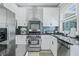 Modern kitchen with stainless steel appliances and white shaker cabinets at 4023 Cedar Hills N Dr, Greenwood, IN 46143