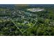 Aerial view showcasing a luxurious home nestled within a lush, wooded estate, near Center Grove High School at 4023 Cedar Hills N Dr, Greenwood, IN 46143