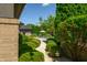 Landscaped pathway leading to a tranquil pool area, providing privacy and serenity at 4023 Cedar Hills N Dr, Greenwood, IN 46143