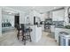 Modern kitchen with white cabinets, stainless steel appliances, and granite countertops at 4023 Cedar Hills N Dr, Greenwood, IN 46143