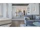 Kitchen with white cabinetry and a center island, visible from living room at 4023 Cedar Hills N Dr, Greenwood, IN 46143