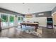 Game room with pool table, arcade game, and access to patio at 4023 Cedar Hills N Dr, Greenwood, IN 46143