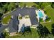 Luxury estate with a large pool and expansive courtyard. This home is perfect for entertaining at 4023 Cedar Hills N Dr, Greenwood, IN 46143