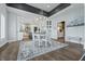 Bright dining room features a white table with chairs and an elegant chandelier at 4023 Cedar Hills N Dr, Greenwood, IN 46143