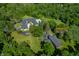 Aerial view of a home with a 30x60 barn including a 12x12 overhead door, 8x8 garage door and 20x28 shop at 4023 Cedar Hills N Dr, Greenwood, IN 46143