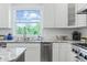 Kitchen sink with granite countertops and white cabinets at 4023 Cedar Hills N Dr, Greenwood, IN 46143