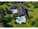 An expansive estate with a large pool and plenty of outdoor space for relaxation and entertainment at 4023 Cedar Hills N Dr, Greenwood, IN 46143