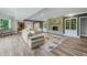 Spacious finished basement with a large sectional sofa and stone fireplace at 4023 Cedar Hills N Dr, Greenwood, IN 46143