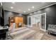 Finished basement home office with built-in cabinetry and hardwood floors at 4023 Cedar Hills N Dr, Greenwood, IN 46143