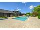 Spacious backyard oasis with a large, inviting pool and ample patio space for entertaining at 4023 Cedar Hills N Dr, Greenwood, IN 46143
