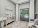 Elegant entryway with double doors, hardwood floors, and decorative console table at 4023 Cedar Hills N Dr, Greenwood, IN 46143