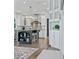 Modern kitchen with a large island, stainless steel appliances, and white cabinets at 4023 Cedar Hills N Dr, Greenwood, IN 46143