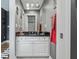 Bathroom with white vanity, black countertop, and checkered towels at 4023 Cedar Hills N Dr, Greenwood, IN 46143